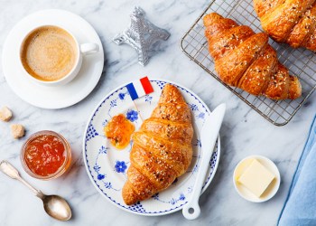 Croissants with baking ingredients. Traditional French pastry. Top view.