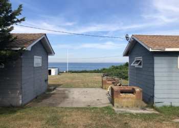 FOUR RAMSHACKLE COTTAGES WITH AN UNOBSTRUCTED VIEW OF FORT POND BAY WILL SOON BE REPLACED BY FOUR HIGH-END RESORT UNITS.