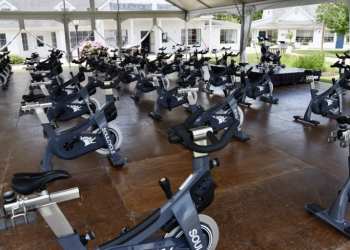 SOULCYCLE'S OUTDOOR SET UP IN WATER MILL. INDEPENDENT/JAMES J. MACKIN