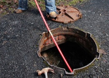 Man clearing the drains