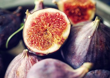 Figs and Sweet Honey on Wooden Background