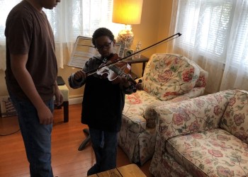 Riverhead-Middle-School-music-students-were-recently-tasked-with-teaching-family-members-how-to-play-an-instrument.-Independent_Courtesy-Riverhead-Central-School-District