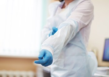 Hand of doctor in gloves.Medical procedure.