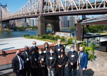 Power Women honorees and their friends and family on the penthouse rooftop of Ravel.