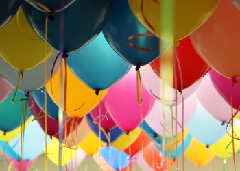 Helium balloons with ribbons in the office