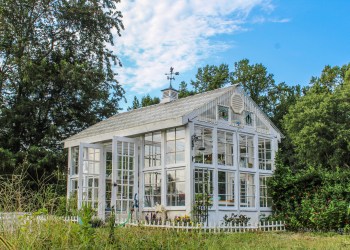 Beautiful Victorian style greenhouse with cupola and weathervane