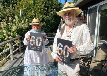 Meeting Dan for the first time on his deck in Easthampton and giving him the souvenir 60th anniversary tabletop book.