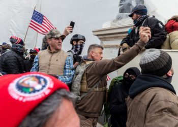 This image, included in federal investigators' criminal complaint, shows Proud Boy Christopher John Worrell allegedly spraying pepper spray gel at Capitol officers during the January 6 riot