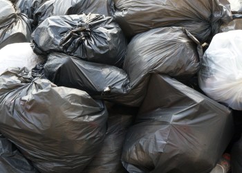 Garbage in the black bag in the waste pile - Not separating waste for Recycle