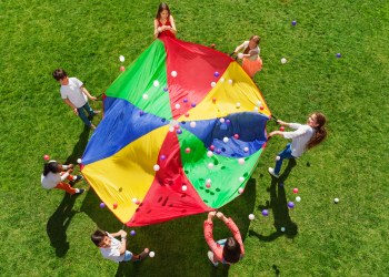 Kids standing in a circle and playing social game