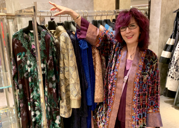 Amy Zerner with rack of her designs