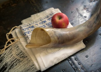 Shofar, Jewish prayer shawl (TALIT) and apple. Yom Kippur, Rosh Hashanah for atonement