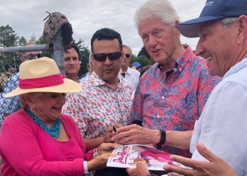 Bill Clinton graciously signed a copy of Dan’s Papers and hat for Victoria Schneps at the 2021 Artists & Writers Game
