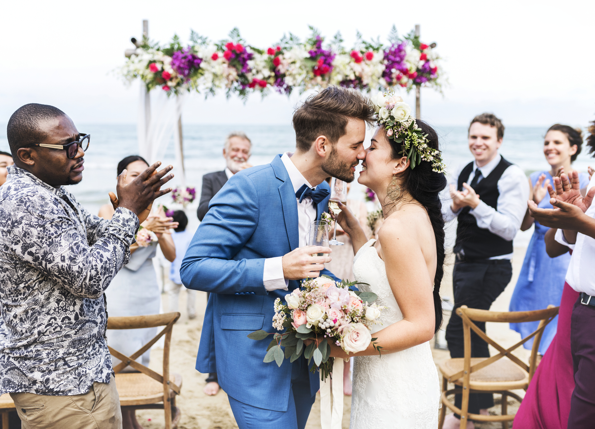 Young couple kissing at wedding reception