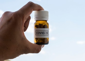 Novel coronavirus disease 2019-nCoV Hand held pills bottle for COVID treatment