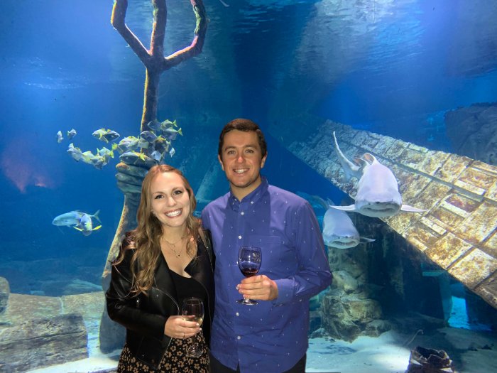 Jess and Matt enjoy Fish and Sips as a resident shark looks on at Long Island Aquarium - Fish and Sips is back at Riverhead Aquarium on the North Fork