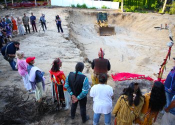 Shinnecock Nation members and friends gather to honor remains found at a development on the tribe's sacred Sugar Loaf Hill burial grounds