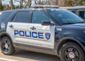 A Westhampton Beach police car emblazoned with the department’s oath “To protect and serve”