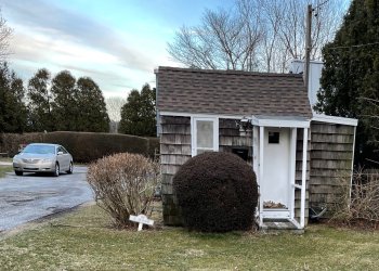 Car parking next to tiny house in the Hamptons