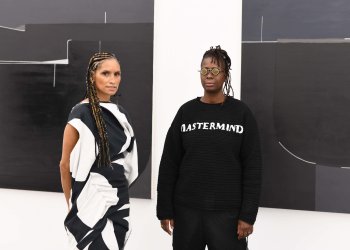 Racquel Chevremont and Mickalene Thomas, in front of work by Torkwase Dyson in 
