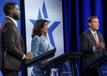 New York Public Advocate Jumaane Williams, left, New York Governor Kathy Hochul, center, listen as Congressman Tom Suozzi (D-NY), speak during New York's governor primary debate at the studios of WCBS2-TV, June 7, 2022, in New York.