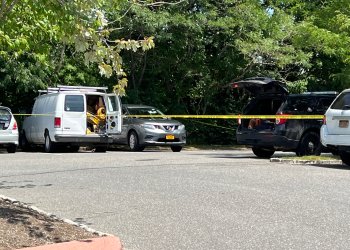 A man was found dead in this white van in Bridgehampton Commons on Thursday