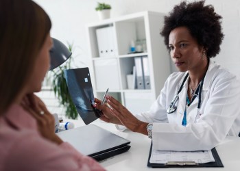 Female doctor looking at mammogram test results of her patient. Breast examination. Mammogram. Health care concept, medical insurance. Womens health.