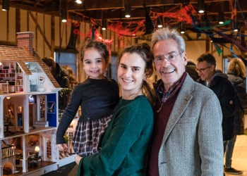 Barrett Green, Lindsey Green, and Keith Green with Barrett's Dollhouse at The Church Holiday Maker's Market