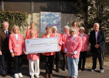 Stony Brook Eastern Long Island Hospital Auxiliary shows off a giant donation check