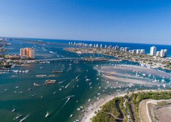 Aerial view of Peanut Island in Riviera Beach, Florida on memorial day weekend. Clear skies and blue water with plenty of boaters palm beach