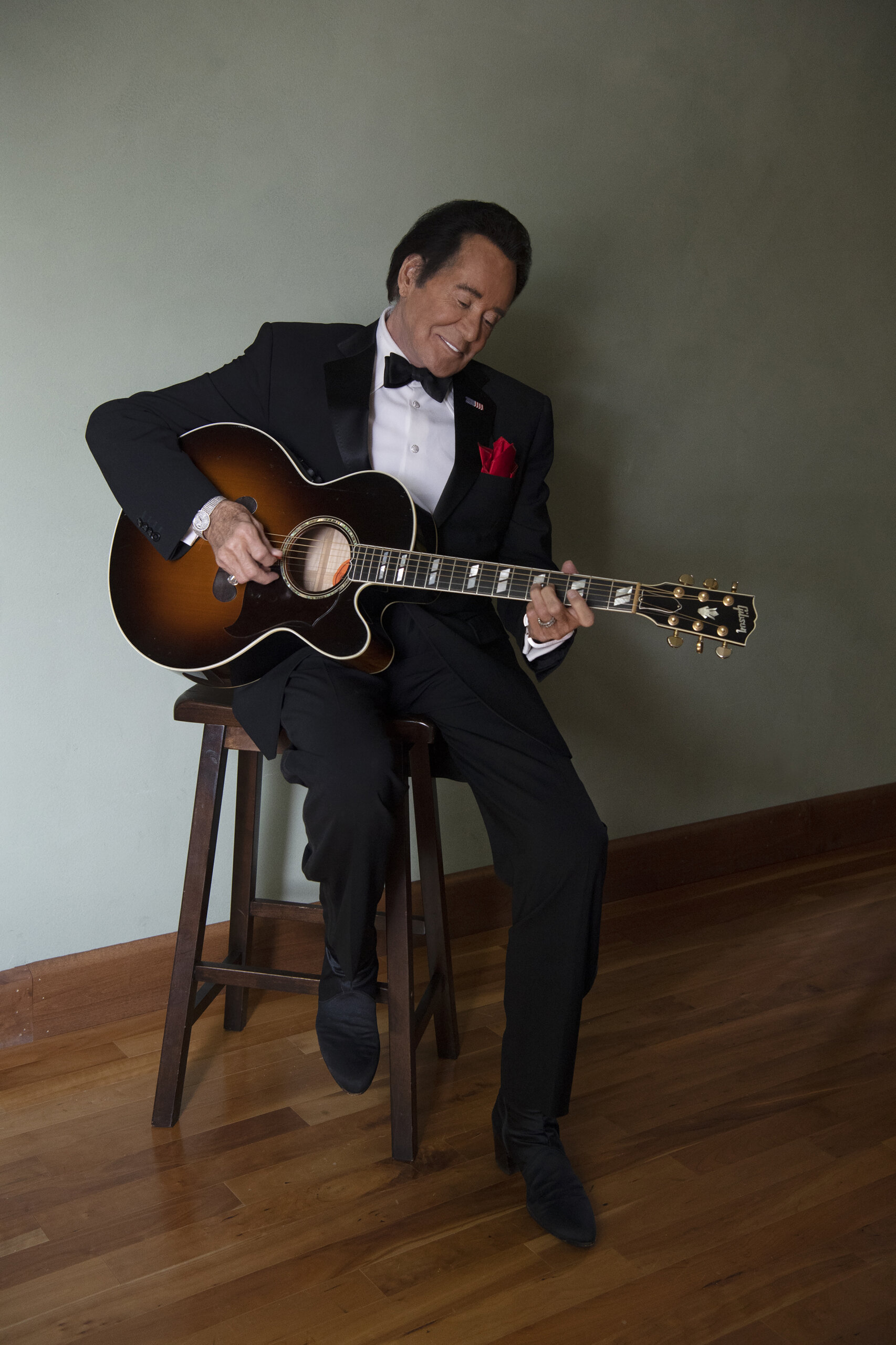 Wayne Newton playing guitar