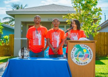 Jason Smith, Jaden Smith, and Melissa Royal at Habitat for Humanity Event