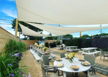 The lovely backyard space where Naturally Good Cafe's new dinner series takes place every Tuesday night all summer in Montauk