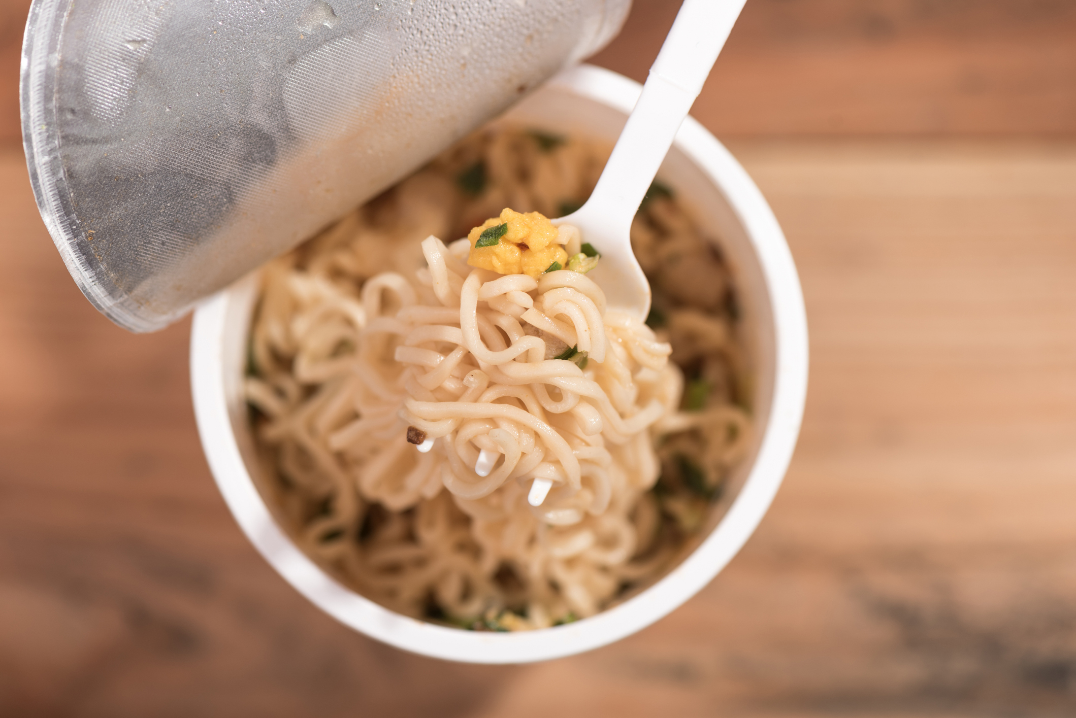 Noodle Cup,noodle ramen soup in a cup,on wooden background