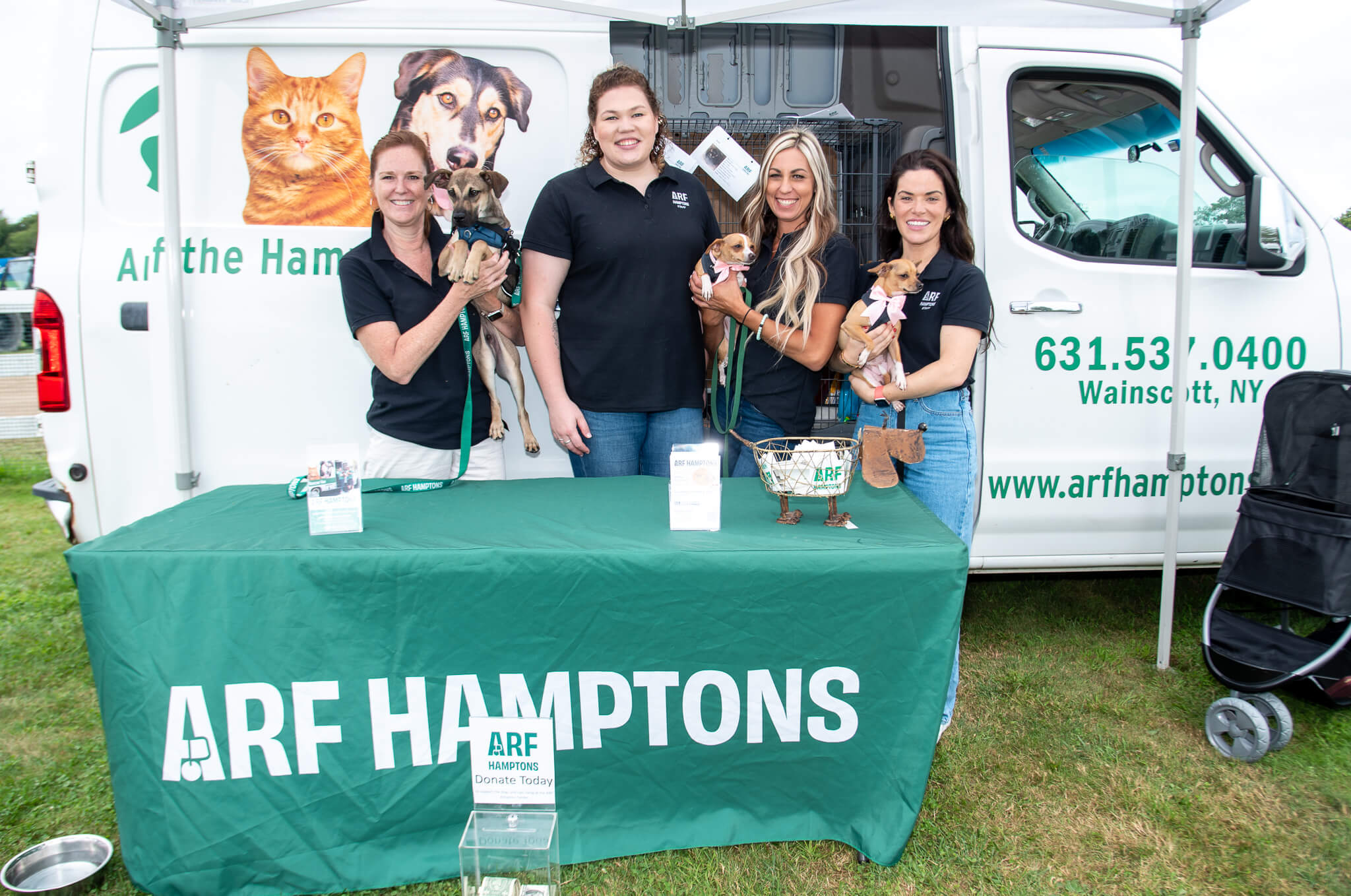 ARF (Animal Rescue Fund) with adoptable dogs at the Hampton Classic