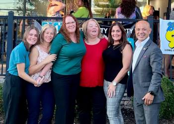 Jessica Maloney, Anyelis Espinal, Maureen Klersy, Christen Olsen, Staci Basuino, Hector Castillo at Exit Realty's Riverhead Location Ribbon Cutting