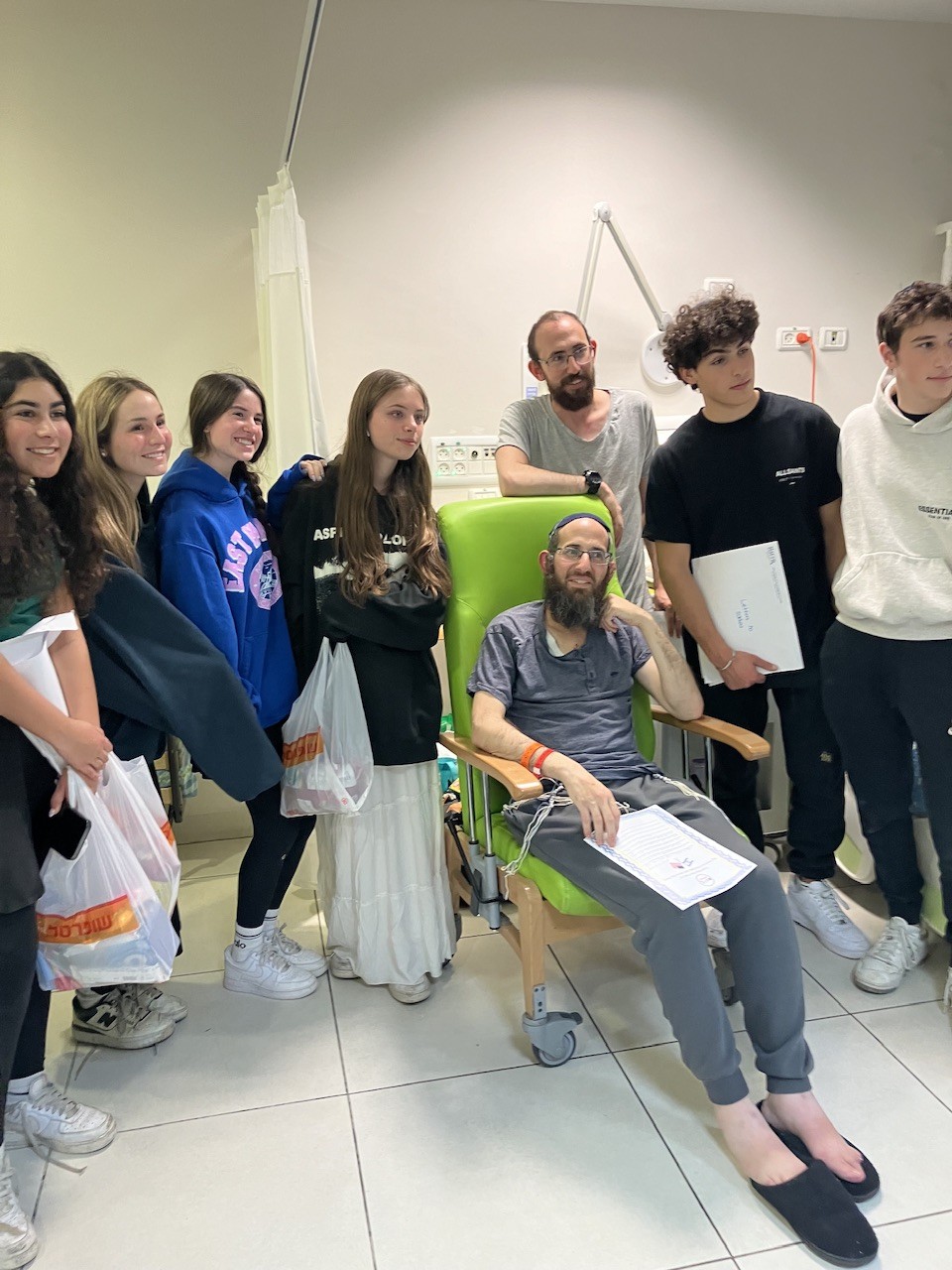 Students including Laila LEvin of Westhampton Beach, visit wounded Israeli soldiers in the hospital in Israel