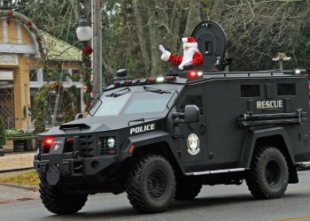 Santa waves from a tank at East Hampton Holiday Parade