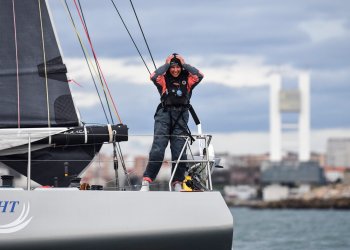 Cole Brauer aboard the First Light as she crossed the finish line in Spain