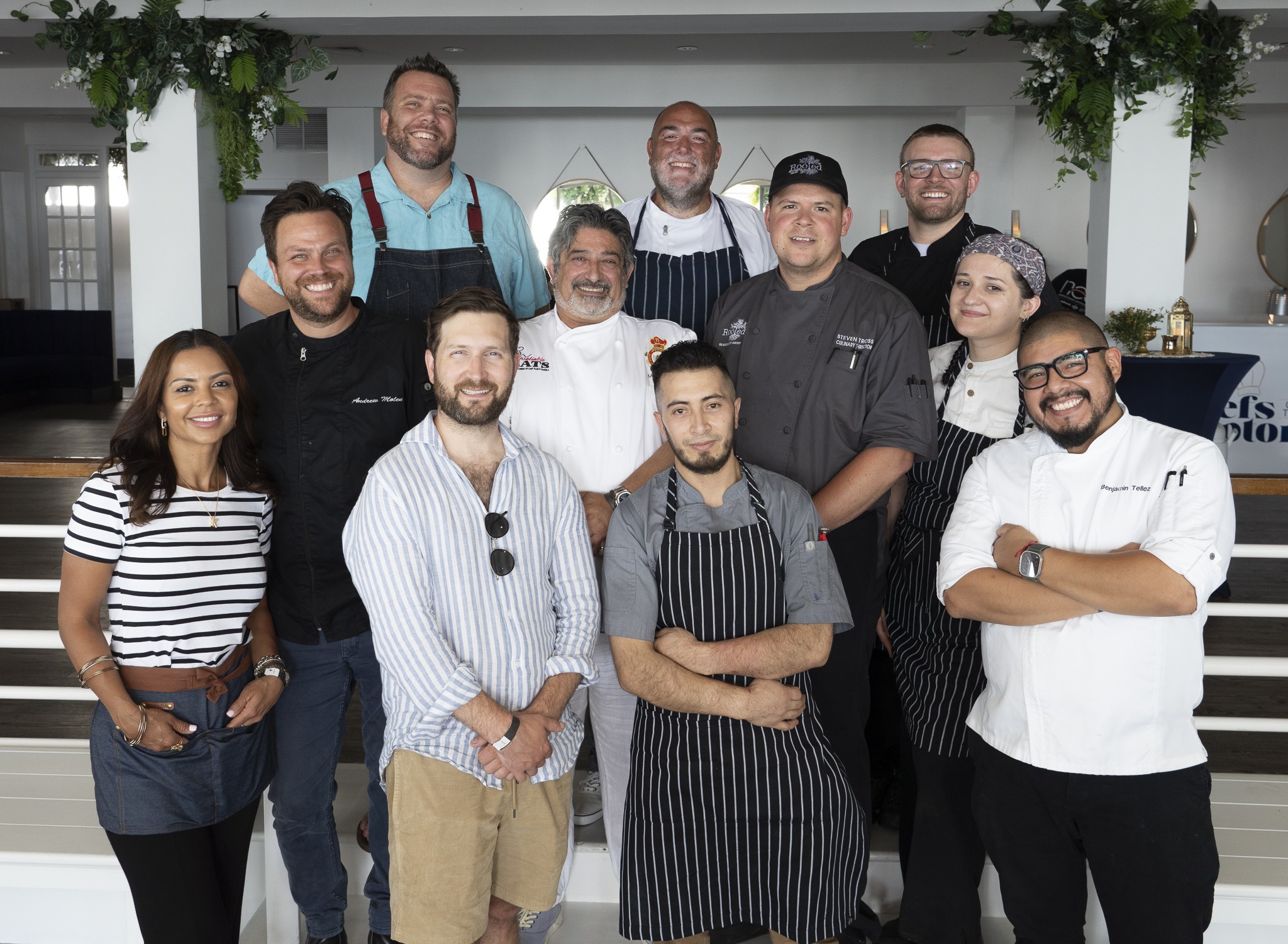 The Chefs of the Hamptons L.-R.: Chef Karoline Cerqueira of Windmill Lane Bakery, Chef Stephen Robinson of Newlight, Chef Bolivar Cabrera of Enchanté, Chef Benjamin Tellez of Kassaki, second row Chef Andrew Molen of Isola, Chef Mario Barrila of Barrila's Pasteria, Chef David Hersh Fauna, Chef Samantha Gregory of Sí Sí third row Chef Christopher Watts of Watts Cooking Tonight, Chef Darrn Boyle of Claudio's, Chef Nicholas Vogel Area Executive Chef of EHP Hospitality