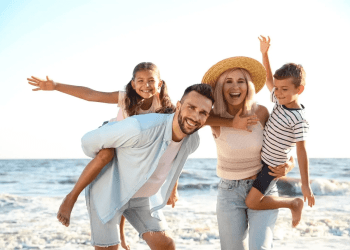 Family on beach moving with Suburban Jungle