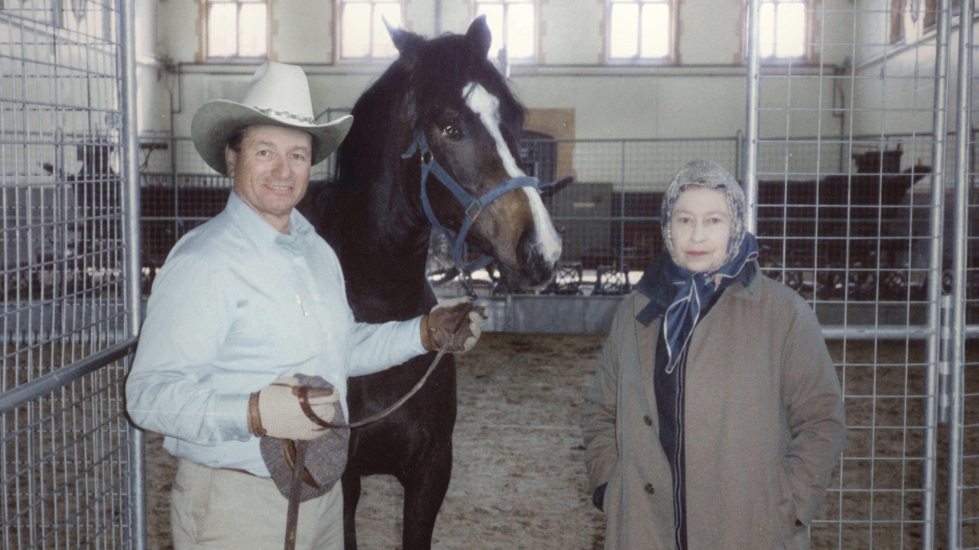 From "The Cowboy and the Queen," Monty Roberts, left, and his friend Queen Elizabeth II. The pair met over a common love for horses.