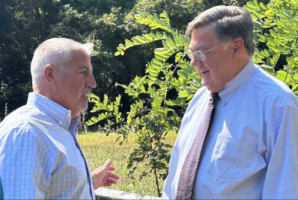 Suffolk County Legislator Jim Mazzarella, left, speaks with Suffolk County Executive Ed Romaine