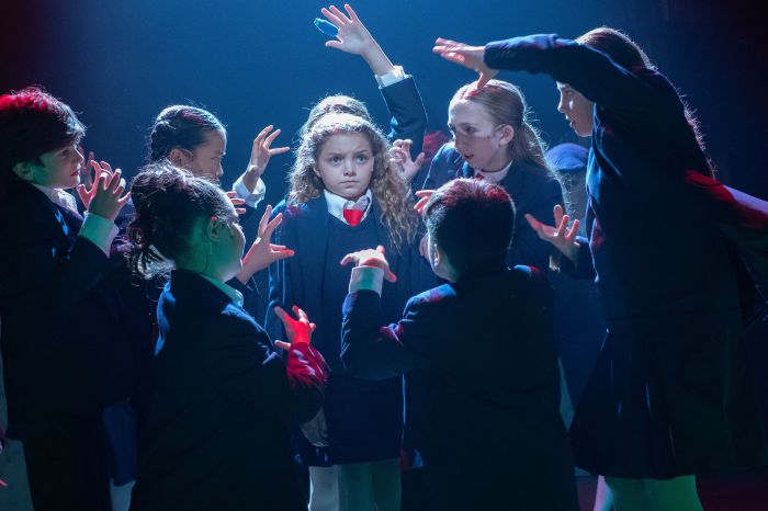 Matilda (Sadie Mathers) and Company in Matilda The Musical at Theatre Three