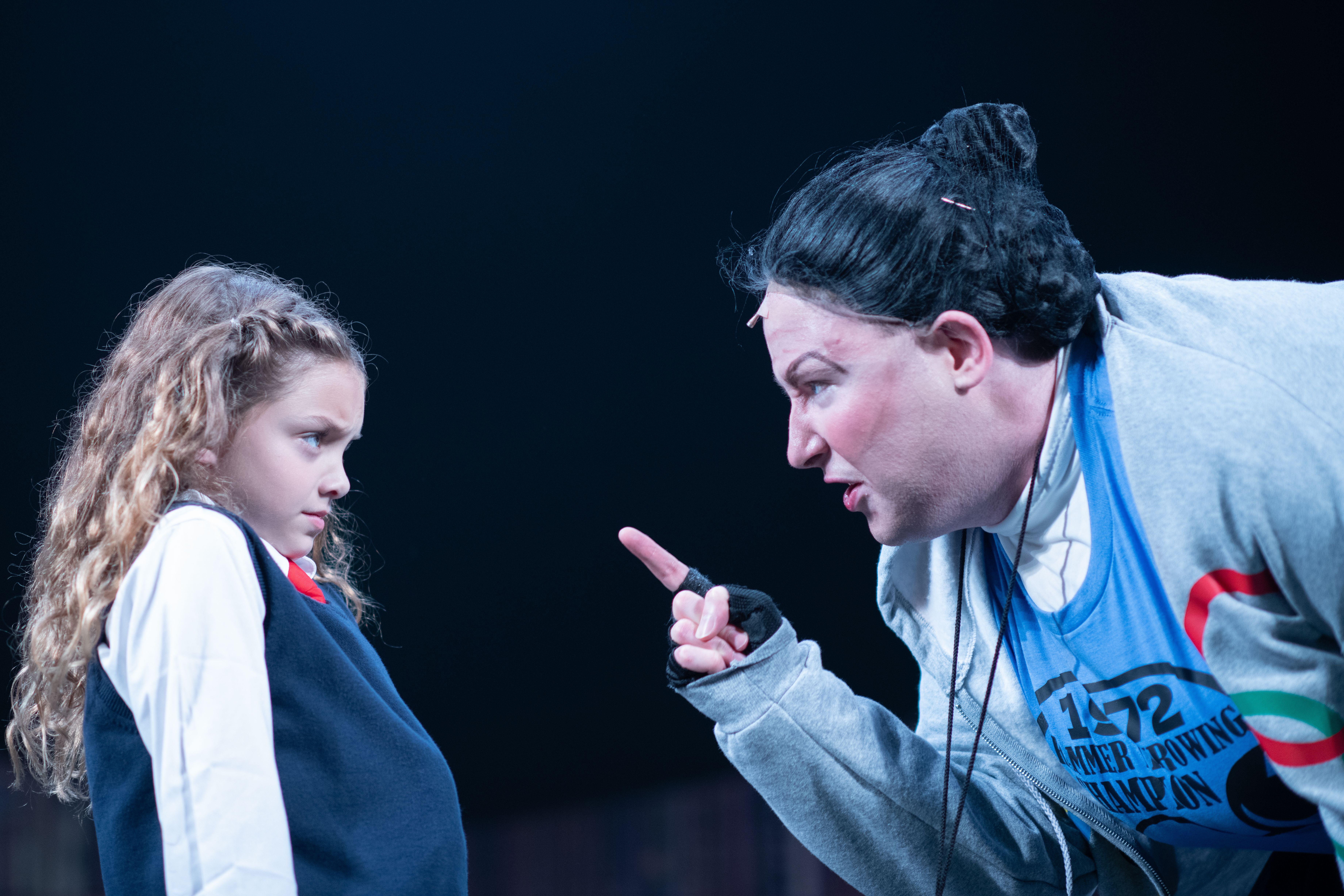 Matilda (Sadie Mathers) and Miss Trunchbull (Liam Marsigliano) in Matilda The Musical at Theatre Three