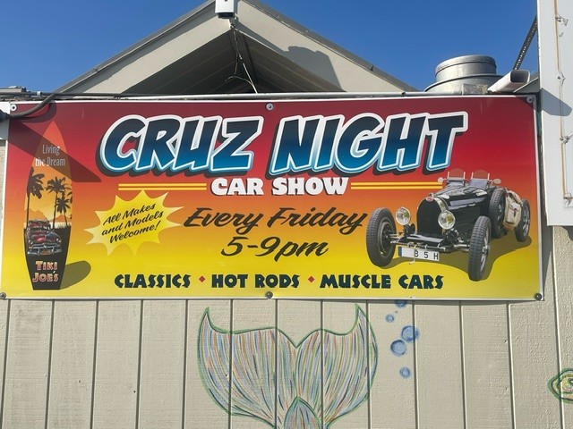 A sign advertises the Meschutt Beach Car Show at Tiki Joe’s restaurant, bar, and beach club