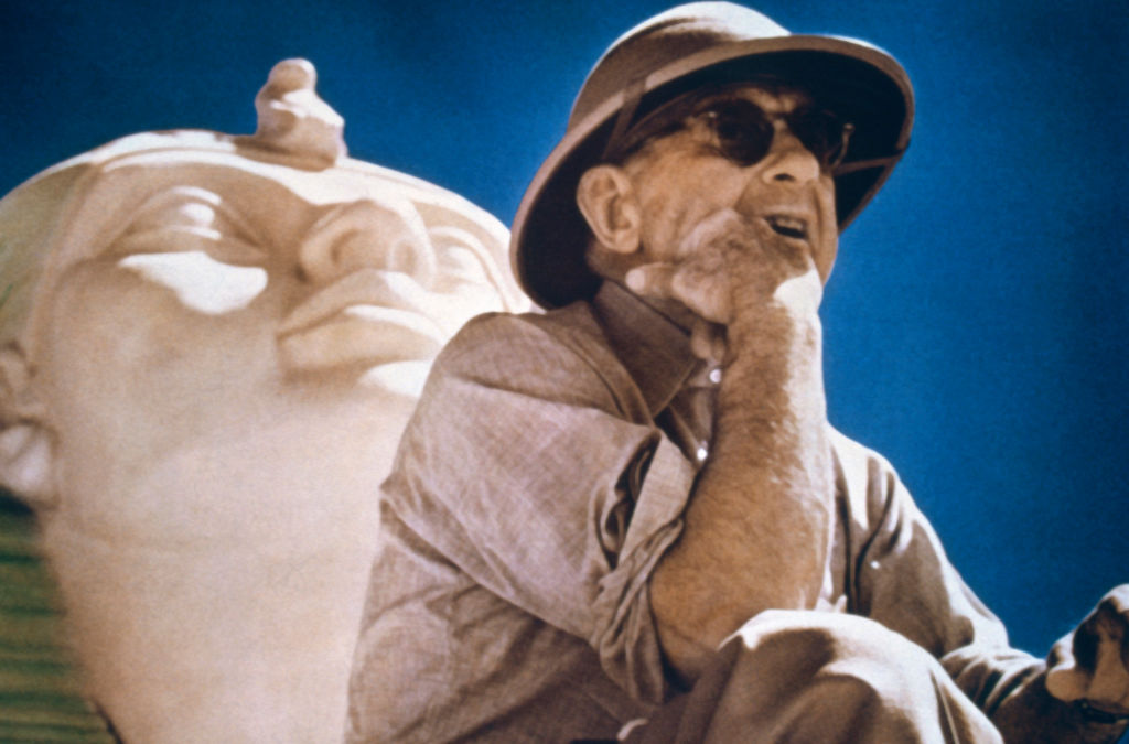 Cecil B. DeMille film director posing by Egyptian Sphinx on the set of his 1956 Biblical epic 'The Ten Commandments'.