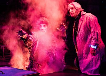 Scrooge (Jeff Sanzel) and Jacob Marley (Stephen T. Wangner) in A Christmas Carol at Theatre Three 2024