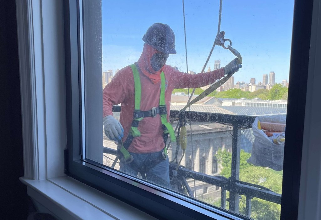 NYC construction worker climbs up to say hi.