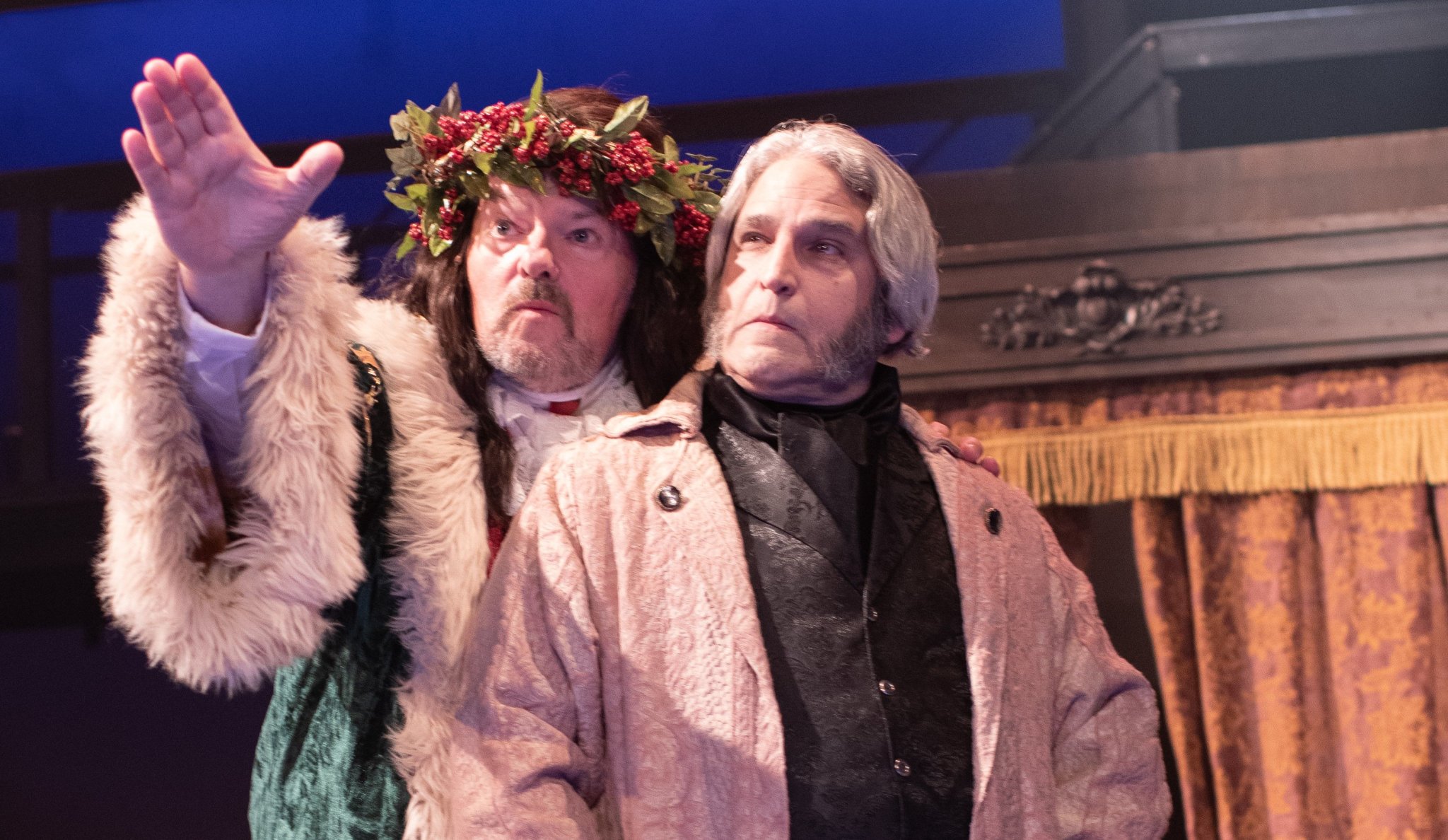 Scott Hofer as the Ghost of Christmas Present and Jeff Sanzel as Scrooge in A Christmas Carol at Theatre Three 2024